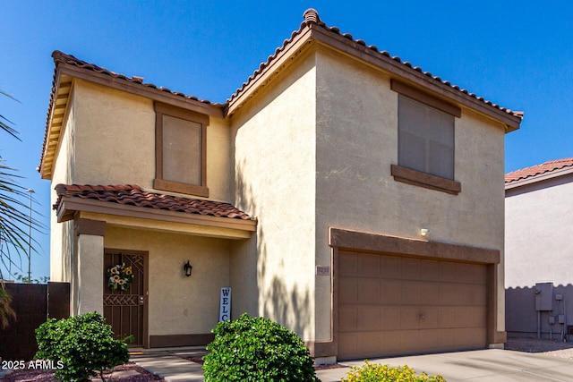 3235 S Bowman Rd, Apache Junction, AZ 85119 - view of front of house featuring an attached garage, a tile roof, stucco siding, and concrete driveway