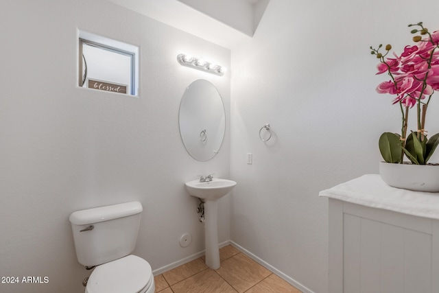 bathroom with tile patterned flooring and toilet