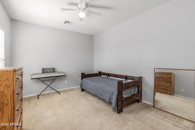 bedroom with light carpet and ceiling fan