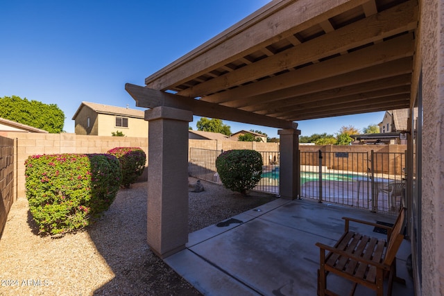 view of patio featuring a fenced in pool