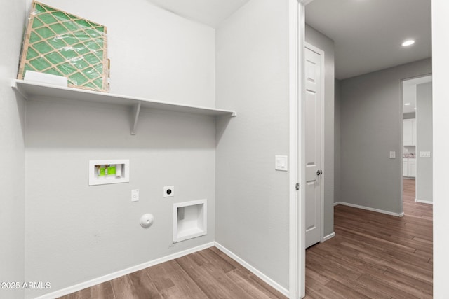 laundry room featuring hardwood / wood-style flooring, gas dryer hookup, hookup for a washing machine, and electric dryer hookup