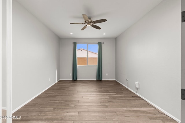 unfurnished room featuring ceiling fan and light hardwood / wood-style flooring