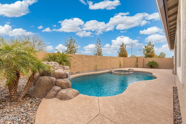 view of pool featuring an in ground hot tub and a patio