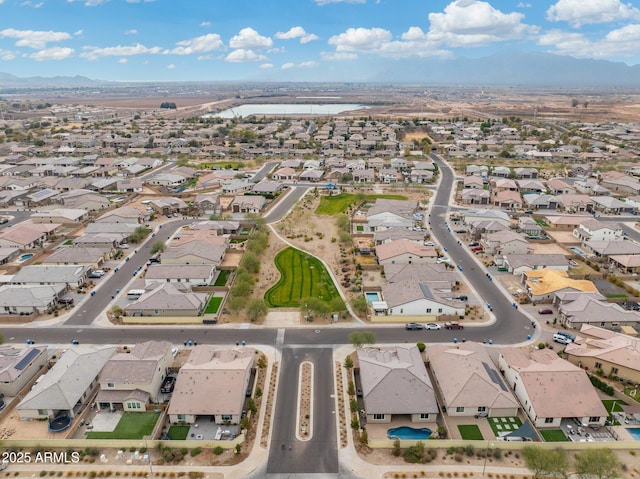 birds eye view of property with a mountain view