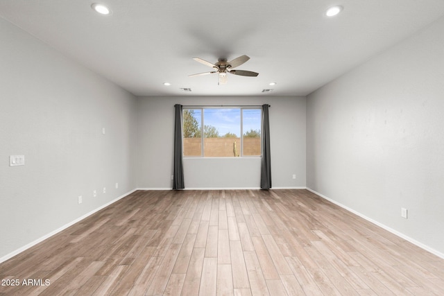 unfurnished room featuring ceiling fan and light wood-type flooring