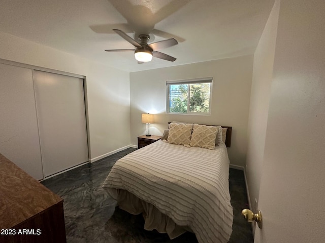 bedroom featuring ceiling fan and a closet