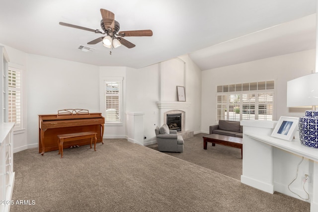 3772 E Leah Ln, Gilbert, AZ 85234 - living room with carpet, a ceiling fan, and a tile fireplace