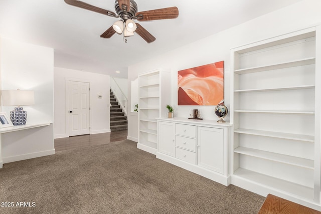 3772 E Leah Ln, Gilbert, AZ 85234 - unfurnished living room with carpet floors, ceiling fan, stairs, and built in features