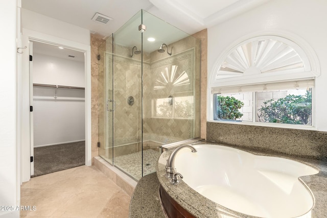 3772 E Leah Ln, Gilbert, AZ 85234 - full bath with a shower stall, a garden tub, tile patterned floors, and a spacious closet