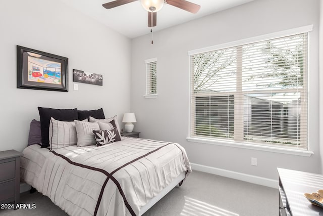 bedroom featuring ceiling fan and carpet floors