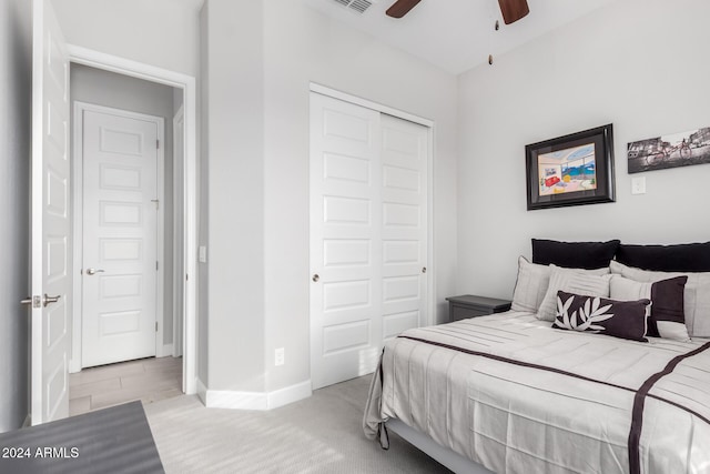 bedroom featuring ceiling fan and a closet