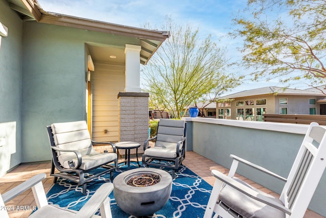 view of patio featuring a fire pit