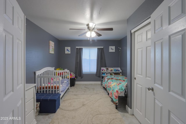 carpeted bedroom featuring ceiling fan