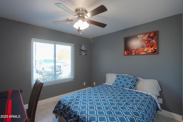 bedroom featuring light tile patterned flooring and ceiling fan