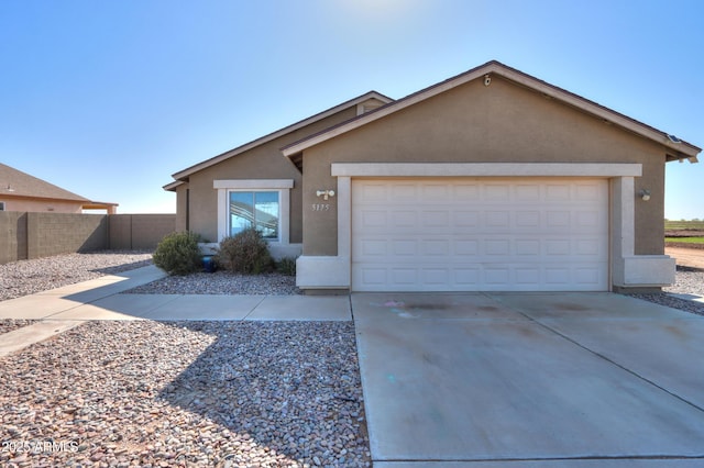 ranch-style home with a garage