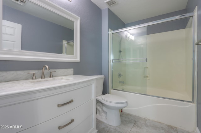 full bathroom featuring vanity, bath / shower combo with glass door, and toilet