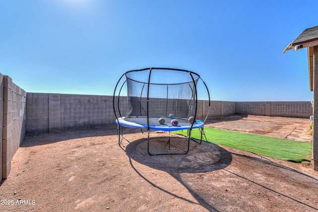 view of yard with a trampoline