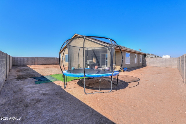 view of yard featuring a trampoline