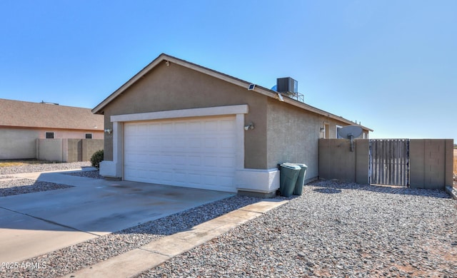 view of property exterior featuring a garage and central air condition unit