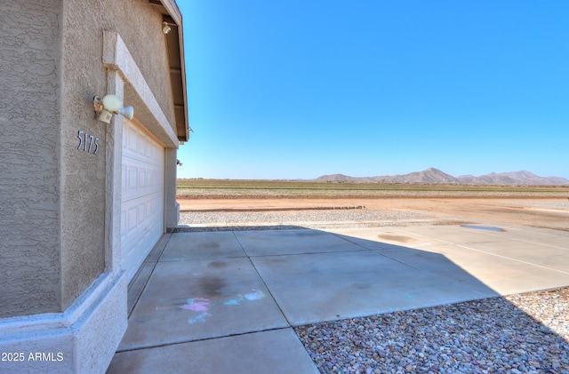 view of patio / terrace with a mountain view