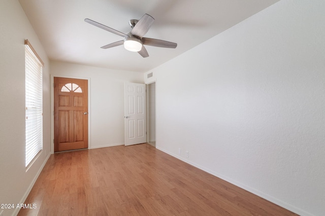 foyer featuring ceiling fan and light hardwood / wood-style flooring