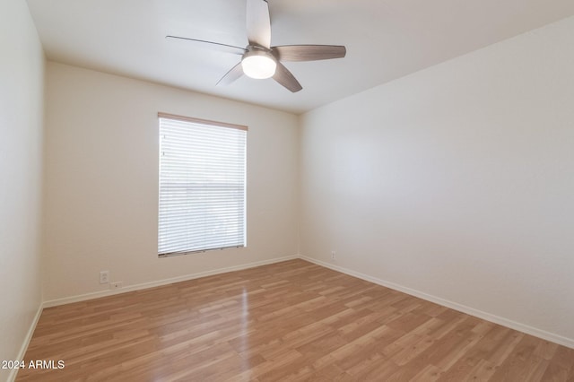 spare room featuring ceiling fan and light wood-type flooring