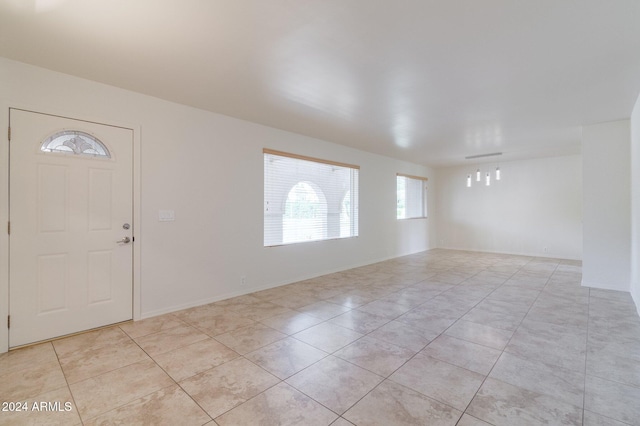 foyer featuring light tile patterned flooring