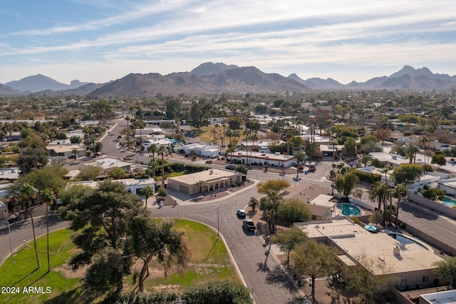 birds eye view of property with a mountain view