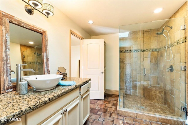 8638 E Paraiso Dr, Scottsdale, AZ 85255 - bathroom featuring vanity, stone finish floor, a stall shower, and recessed lighting