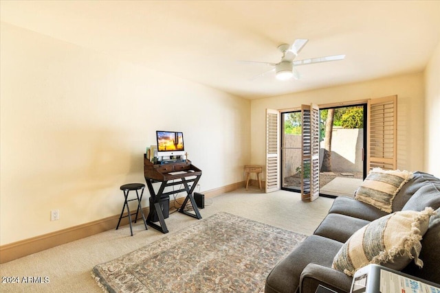 carpeted living room featuring ceiling fan