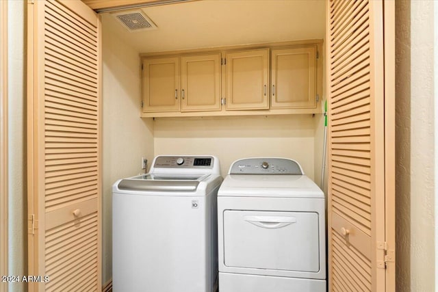 8638 E Paraiso Dr, Scottsdale, AZ 85255 - clothes washing area with washing machine and dryer, cabinet space, and visible vents