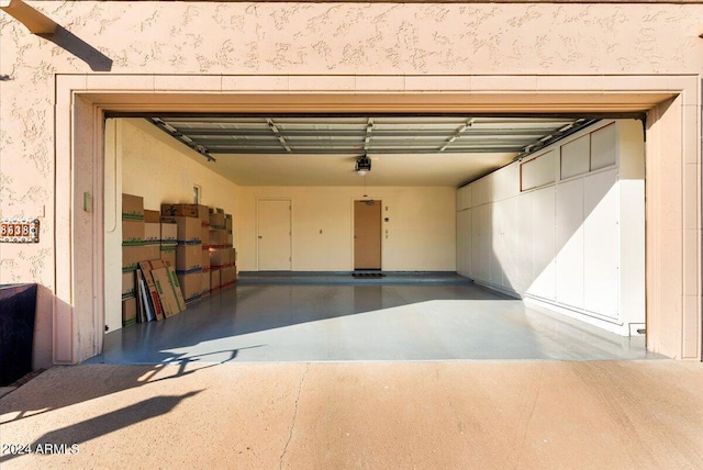 8638 E Paraiso Dr, Scottsdale, AZ 85255 - garage with a garage door opener and wallpapered walls