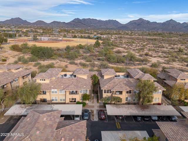 birds eye view of property with a mountain view