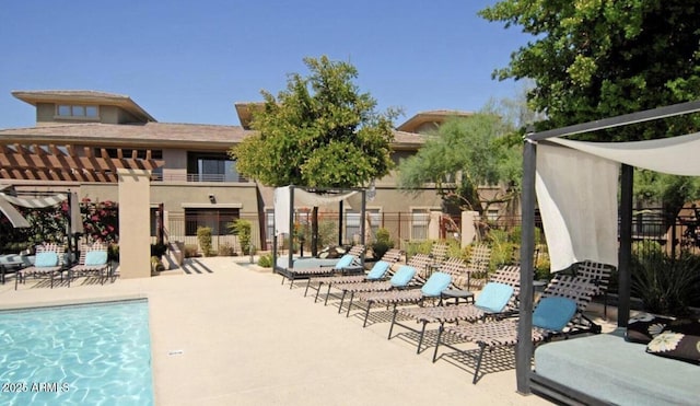 view of pool with a pergola and a patio