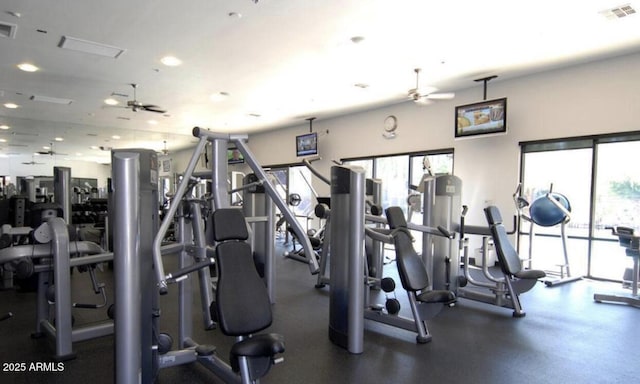 exercise room with ceiling fan