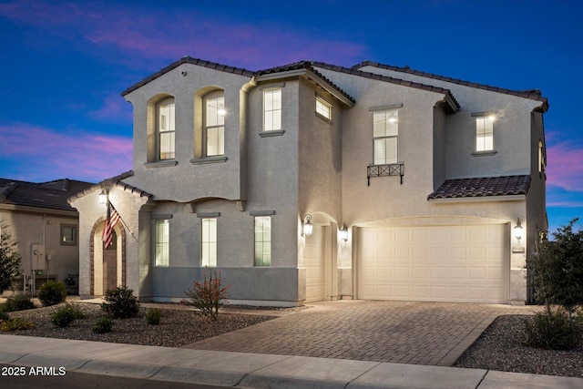 5661 S Dante, Mesa, AZ 85212 - mediterranean / spanish home with a tile roof, decorative driveway, a garage, and stucco siding