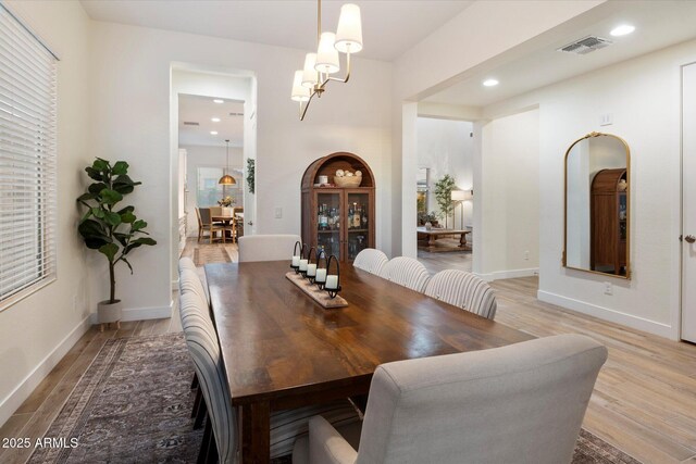 5661 S Dante, Mesa, AZ 85212 - dining space featuring light wood-type flooring, a chandelier, recessed lighting, and baseboards