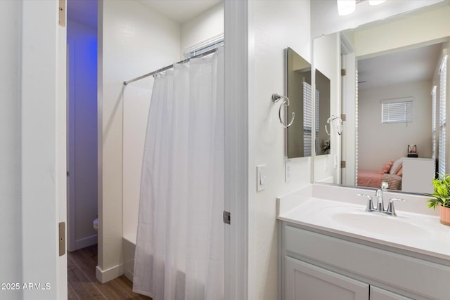 5661 S Dante, Mesa, AZ 85212 - bathroom featuring vanity, wood finished floors, shower / bath combo with shower curtain, and connected bathroom