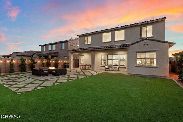 5661 S Dante, Mesa, AZ 85212 - back of house at dusk featuring an outdoor living space, stucco siding, a patio, and a tiled roof