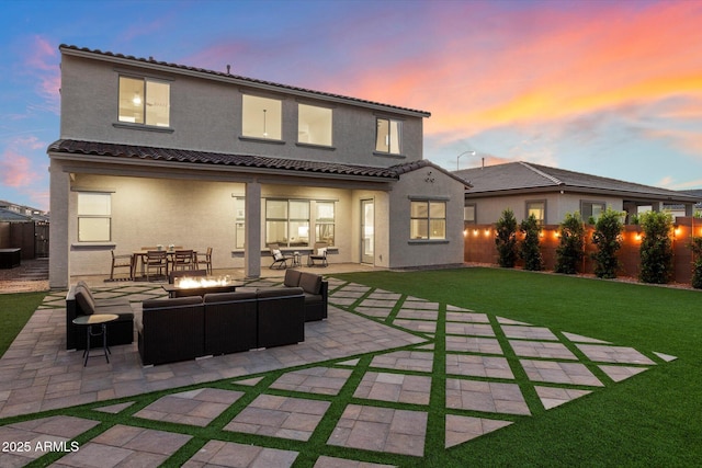 5661 S Dante, Mesa, AZ 85212 - back of house at dusk with outdoor lounge area, stucco siding, a patio area, and a tiled roof