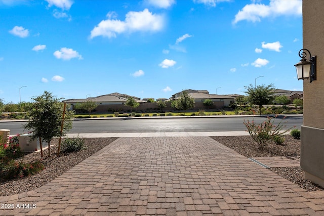 5661 S Dante, Mesa, AZ 85212 - view of asphalt road featuring street lighting, a residential view, and curbs