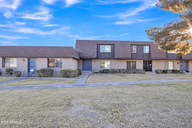 view of front of house with a front lawn