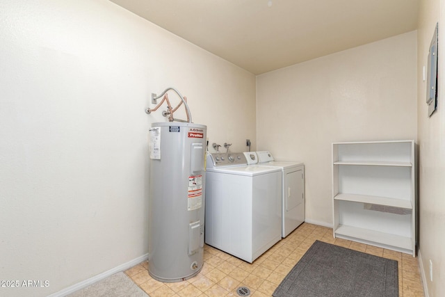 clothes washing area featuring separate washer and dryer and electric water heater