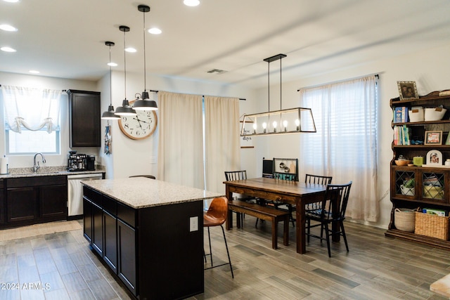 14344 W Hackamore Dr, Surprise, AZ 85387 - kitchen featuring stainless steel dishwasher, a sink, plenty of natural light, a center island, and recessed lighting