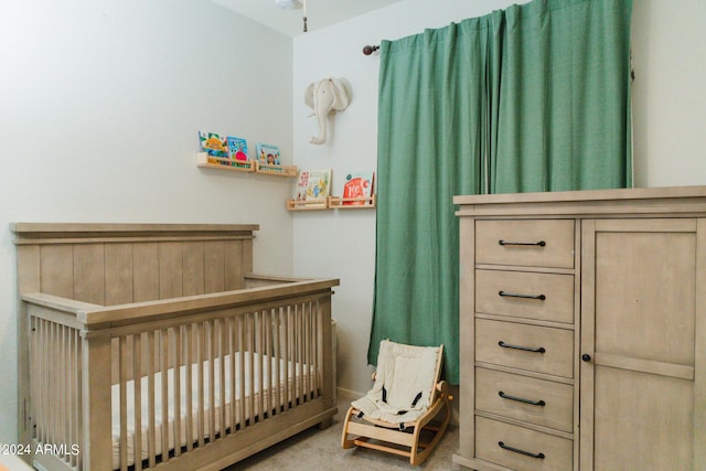 14344 W Hackamore Dr, Surprise, AZ 85387 - bedroom featuring a crib and carpet floors
