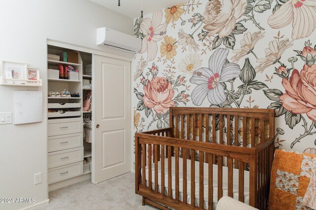 14344 W Hackamore Dr, Surprise, AZ 85387 - bedroom with a wall unit AC, light carpet, and a crib