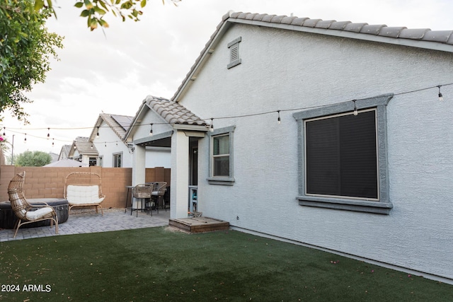 14344 W Hackamore Dr, Surprise, AZ 85387 - rear view of house with a patio, stucco siding, and a tile roof