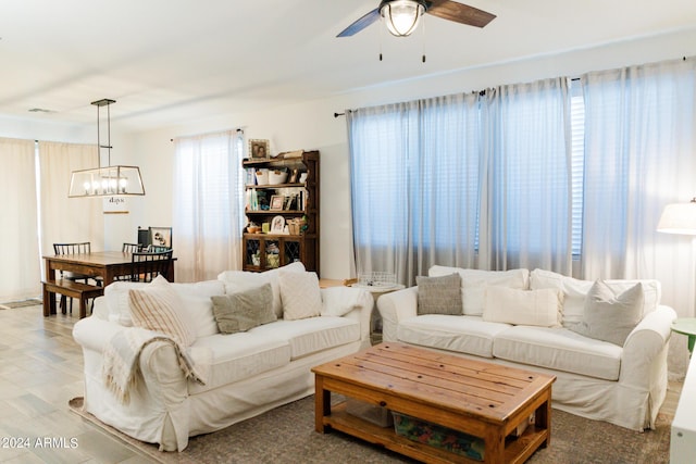14344 W Hackamore Dr, Surprise, AZ 85387 - living room with a chandelier and ceiling fan