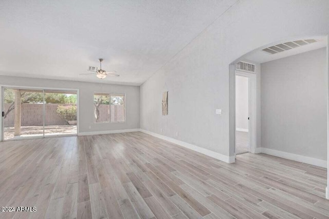 empty room featuring ceiling fan, light hardwood / wood-style floors, and a textured ceiling