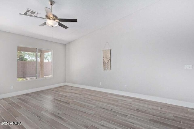 spare room featuring ceiling fan and light hardwood / wood-style flooring